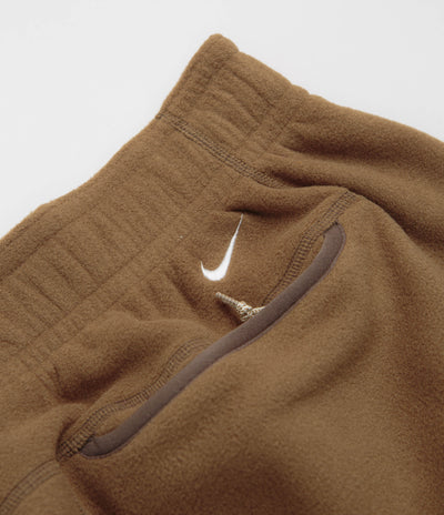 Nike ACG Wolf Tree Pants in Mosswood Brown and Summit White