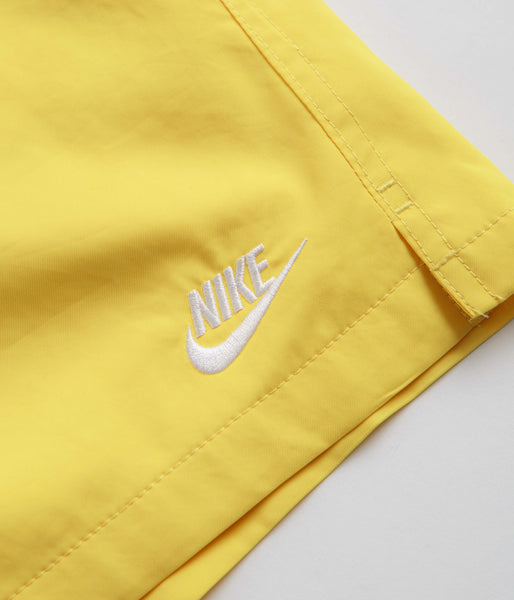 nike club woven shorts in yellow