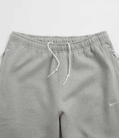 Nike Solo Swoosh Sweatpants in Dark Grey Heather and White