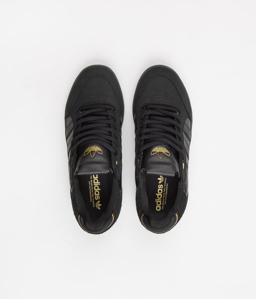 Adidas black best sale and gold shoes