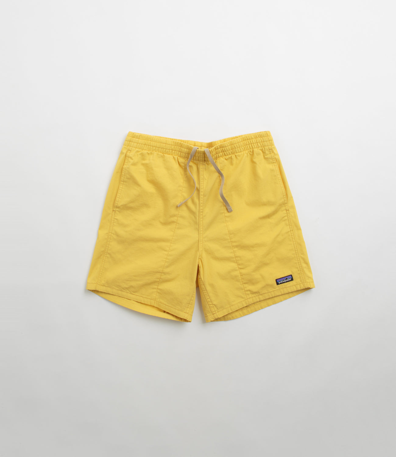 Patagonia baggies surfboard yellow top