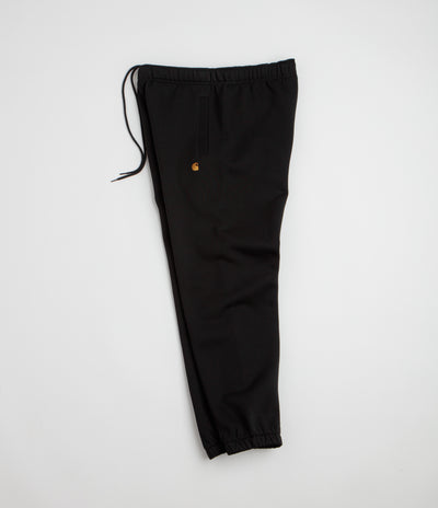 Carhartt Chase Sweatpants in Black and Black / Gold