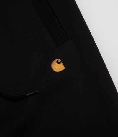Carhartt Chase Sweatpants in Black and Black / Gold