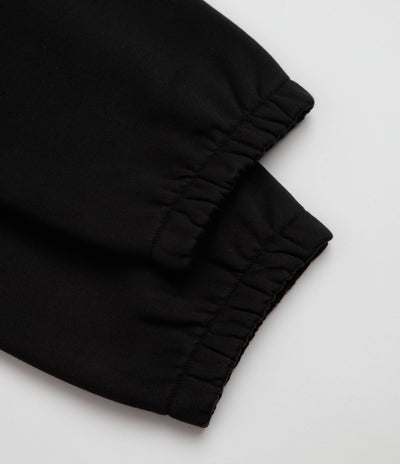 Carhartt Chase Sweatpants in Black and Black / Gold