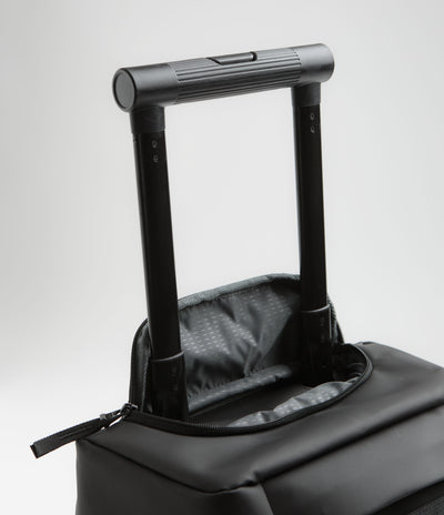 D_b_ Hugger 40L Carry-On Roller Bag in Black Out