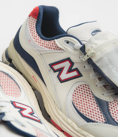 New Balance 2002R Shoes in Sea Salt and Red / Blue