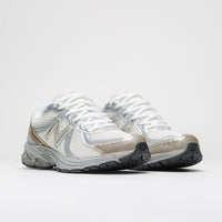 New Balance 860 Shoes in Sea Salt and Gold Metallic thumbnail