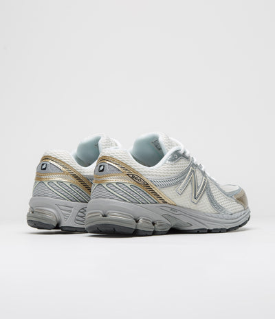 New Balance 860 Shoes in Sea Salt and Gold Metallic