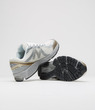 New Balance 860 Shoes in Sea Salt and Gold Metallic