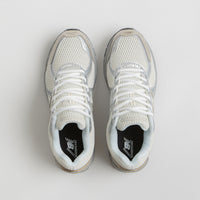 New Balance 860 Shoes in Sea Salt and Gold Metallic thumbnail