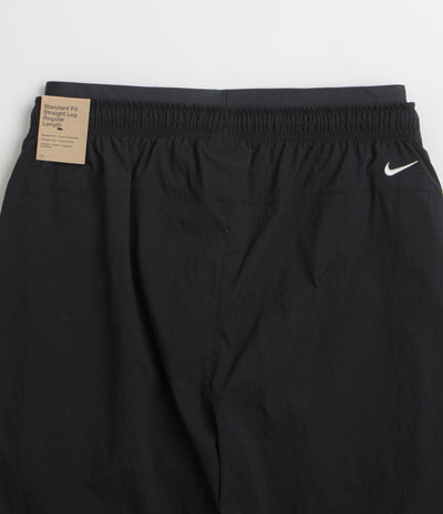 Nike ACG Black Iguana 2-in-1 Trousers in Black and Black / Summit White
