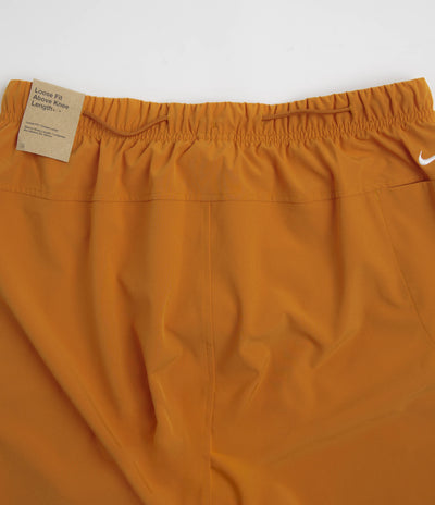Nike ACG New Sands Shorts in Monarch and Dark Russet / Summit White
