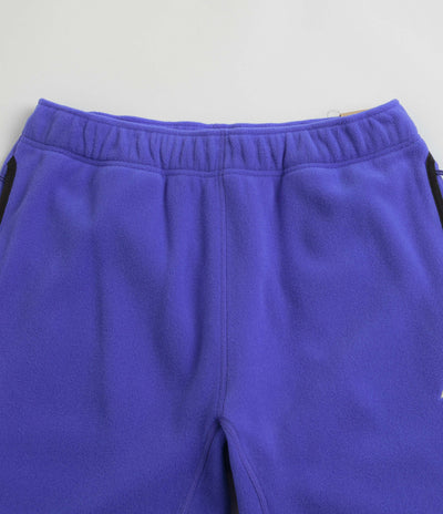 Nike ACG Polartec Wolf Tree Pants in Persian Violet and Summit White