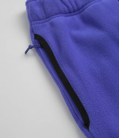 Nike ACG Polartec Wolf Tree Pants in Persian Violet and Summit White