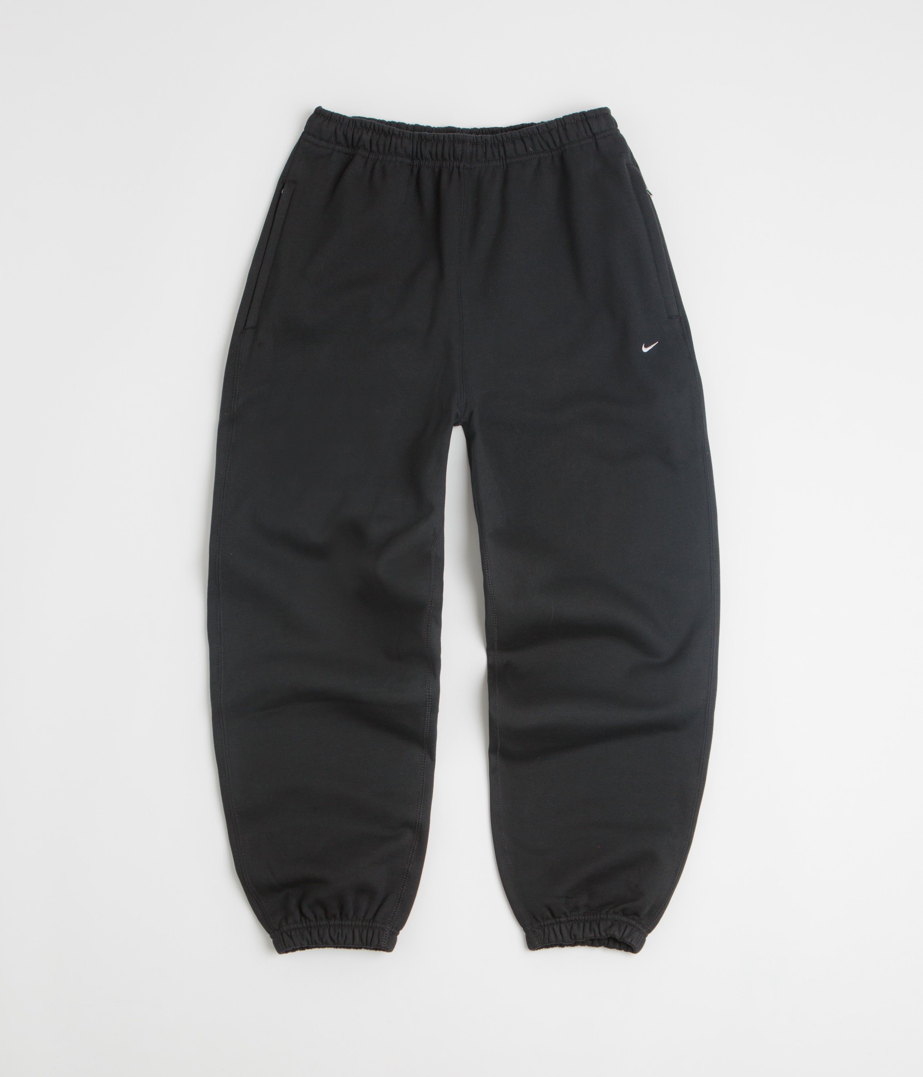 Nike Solo Swoosh Cuffed Sweatpants in Black and Black / White