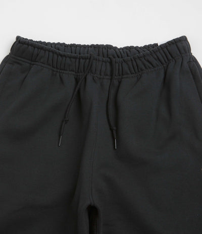 Nike Solo Swoosh Cuffed Sweatpants in Black and Black / White