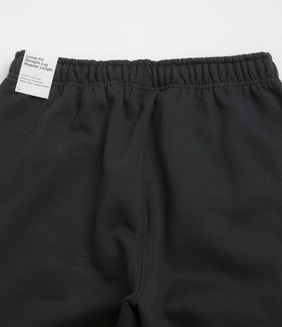 Nike Solo Swoosh Cuffed Sweatpants in Black and Black / White