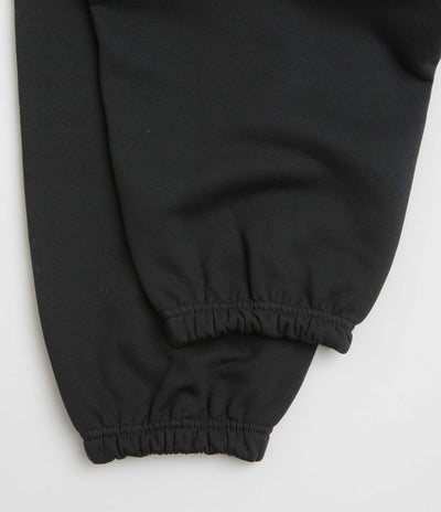 Nike Solo Swoosh Cuffed Sweatpants in Black and Black / White