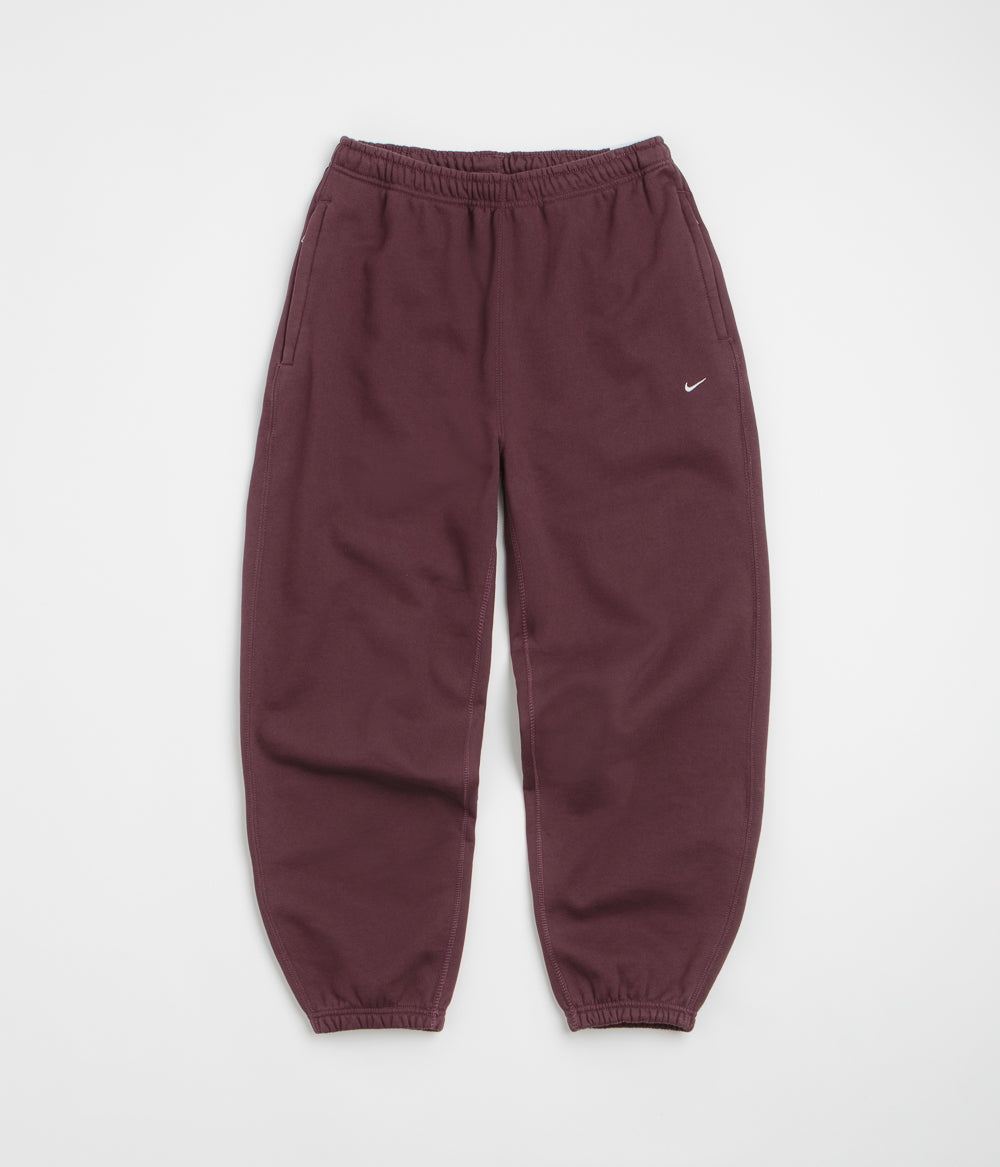 Nike Solo Swoosh Cuffed Sweatpants in Burgundy Crush and Burgundy Crush / White