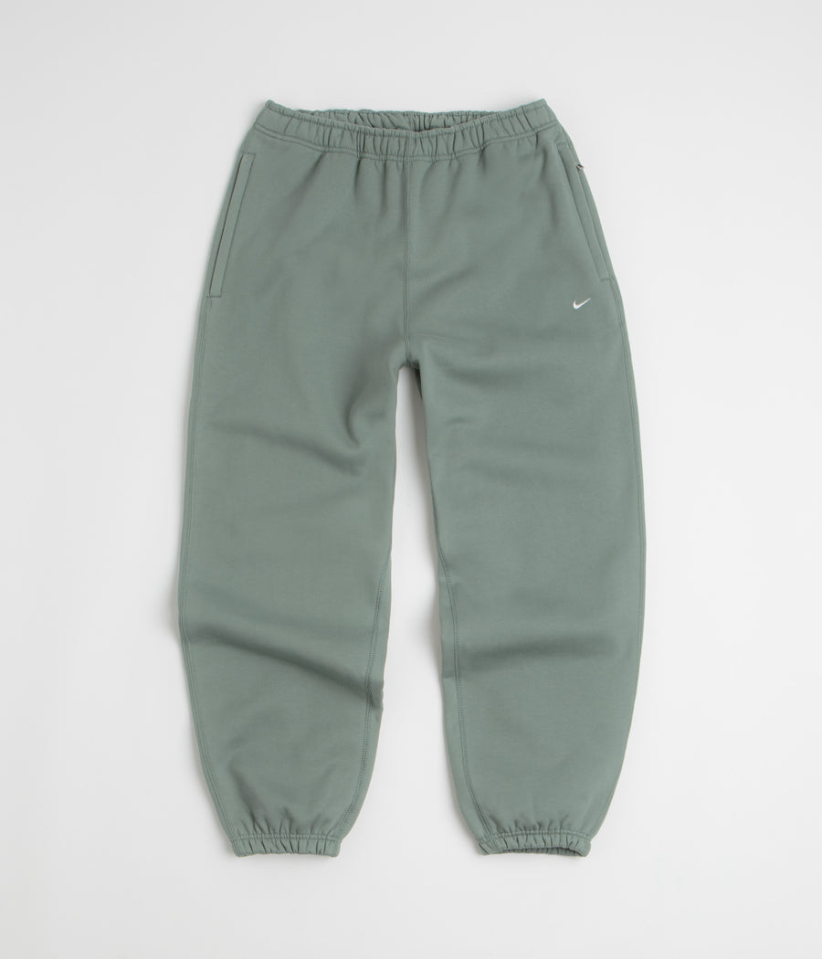 Nike Solo Swoosh Cuffed Sweatpants in Clay Green and Clay Green / White