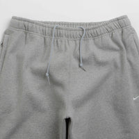 Nike Solo Swoosh Open Hem Sweatpants in Dark Grey Heather and Light Smoke Grey / White thumbnail