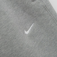 Nike Solo Swoosh Open Hem Sweatpants in Dark Grey Heather and Light Smoke Grey / White thumbnail