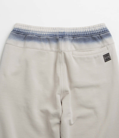 The Trilogy Tapes Overdye Open Hem Sweatpants in Grey and Blue