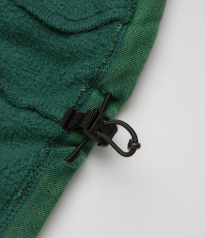 The Trilogy Tapes Spray Funnel Neck Jacket in Sea Moss Green and Back