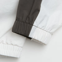Umbro Guarding Masked Tracksuit Jacket in White and Dark Olive thumbnail