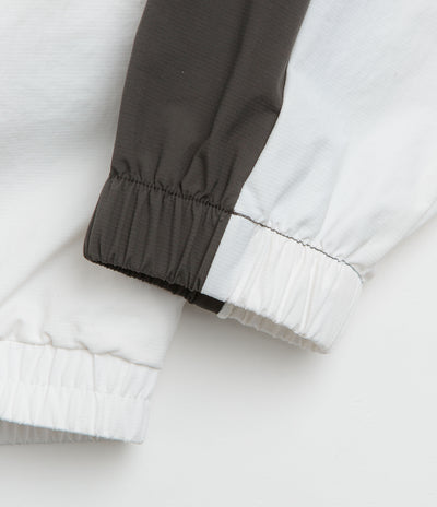 Umbro Guarding Masked Tracksuit Jacket in White and Dark Olive