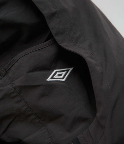 Umbro Rose Crest Masked Track Jacket in Black and Dark Gray