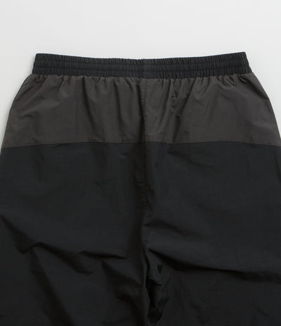 Umbro Rose Crest Track Pants in Black and Dark Gray