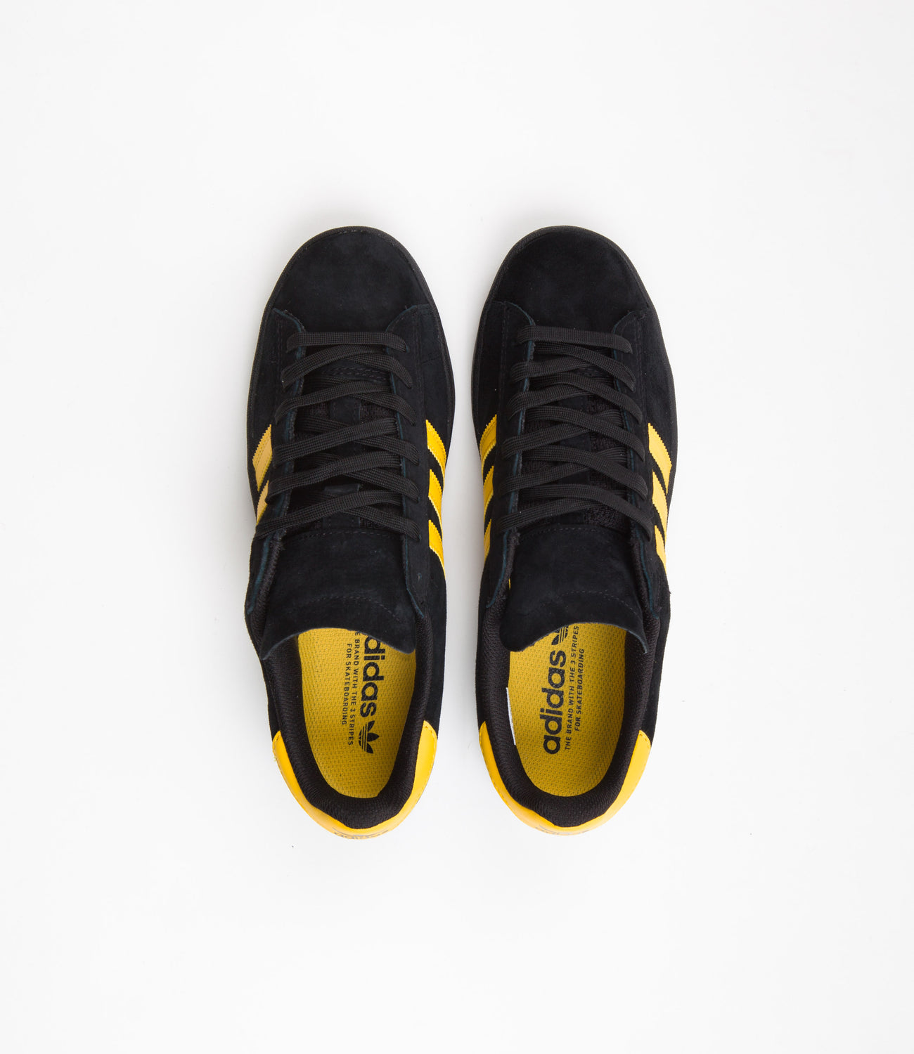 Adidas black shoes with gold stripes store