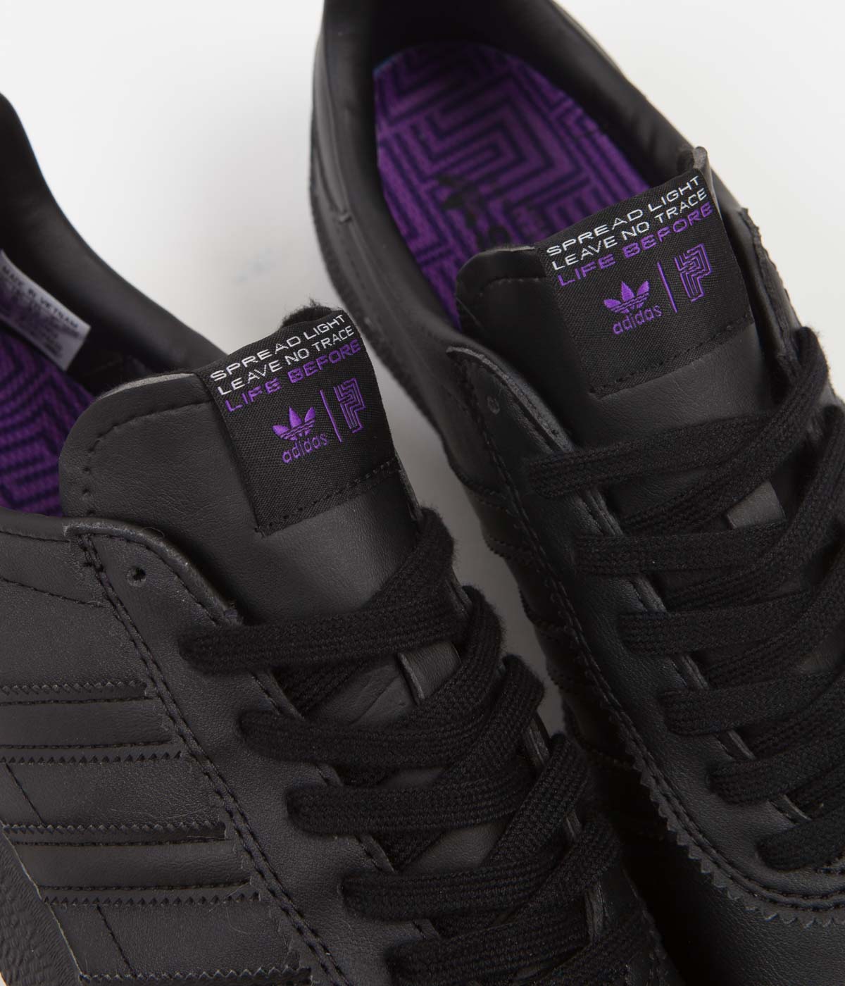 Black and purple adidas shoes top