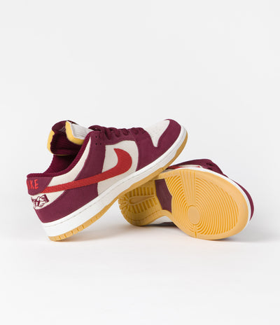 Nike SB x Skate Like A Girl Dunk Low Shoes in Dark Beetroot and Light Crimson and Light Bone
